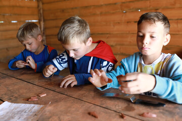 Brothers making mascot with runes