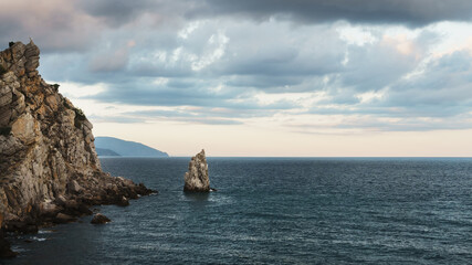 Rocks and sea with evening sky. The natural composition