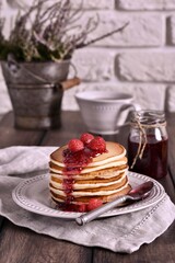 Sweet pancakes with raspberry jam