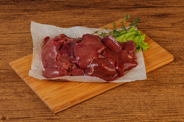Raw chicken liver over board