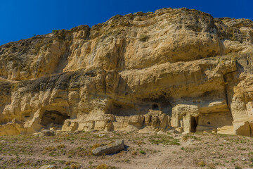 the remains of a medieval fortress city (according to other sources - a monastery) Tepe-Kermen, covering the upper part of the mountain in several tiers