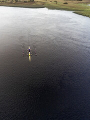 Boat four rowing, Aerial drone view, Corrib river, Galway city, Ireland. Concept outdoor activity, sport, adventure,