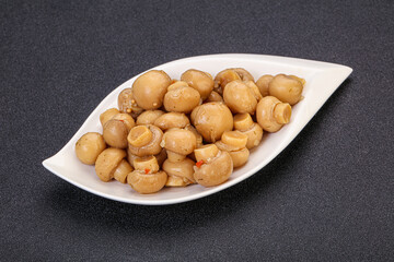 Pickled champignons in the bowl