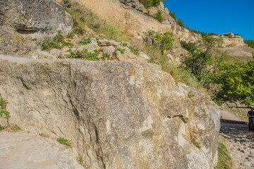 the remains of a medieval fortress city (according to other sources - a monastery) Tepe-Kermen, covering the upper part of the mountain in several tiers