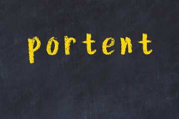 College chalk desk with the word portent written on in