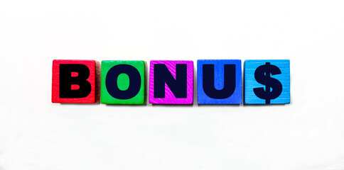 The word BONUS is written on colorful bright cubes on a light background