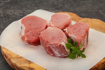 Raw pork medallion served rosemary