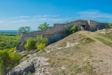 the remains of a medieval fortress city (according to other sources - a monastery) Tepe-Kermen, covering the upper part of the mountain in several tiers
