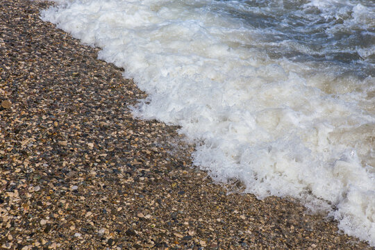 waves on the sea pebble coast close-up