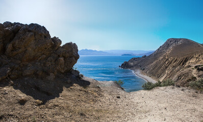 lagoon by the sea lit by the sun in the mountains