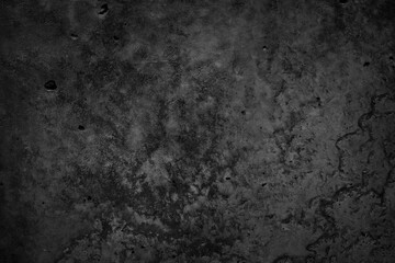 Fototapeta na wymiar Black grunge stone background. Dark concrete cement texture background. Rough dirty concrete wall surface with cracks. Macro.
