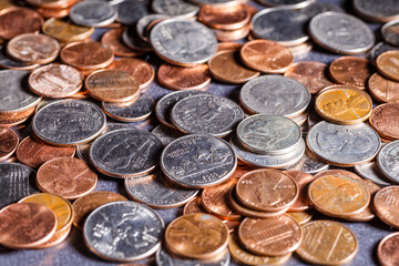 American coins and US dollars on a wooden table