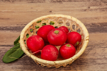 Ripe fresh radish heap over wooden