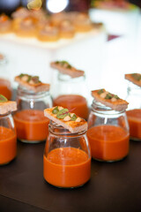 camepe with chili dip over glasses in party