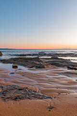 Fototapeta na wymiar Sand and rock on the beach coastline.