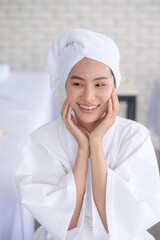 Lady wear bathrobe smile in spa