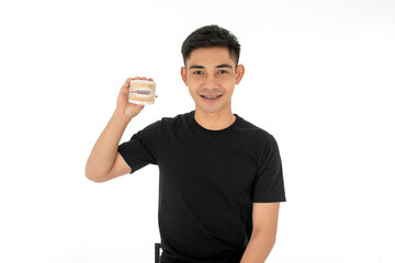 Young asian man smiling with denture