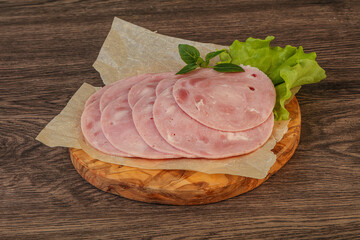 Slised ham snack over board