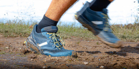 Fototapeta na wymiar Trail running shoes outdoor - panorama