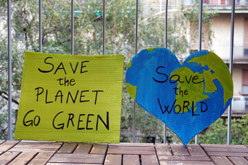 Outdoor portrait of caucasian young woman activist with Save the Planet, World ecology poster -...