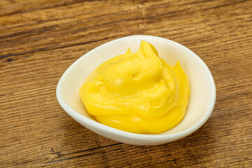 Natural cheese sauce in the bowl