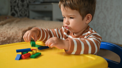 the child develops motor skills with geometric shapes