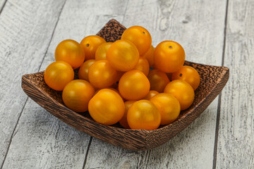 Fresh yellow cherry tomato heap