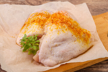Raw chicken thigh with spices