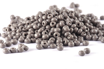 Close up of gray Beads on the white background. Background or texture of beads. macro,It is used in finishing fashion clothes. make bead necklace or string of beads for woman of fashion.