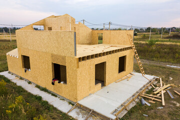 Construction of new and modern modular house. Walls made from composite wooden sip panels with...