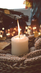 Autumn background with dry leaves, blue cup of coffee. Knitted background, pumpkins, October, November. Autumnal atmosphere. Autumn season.