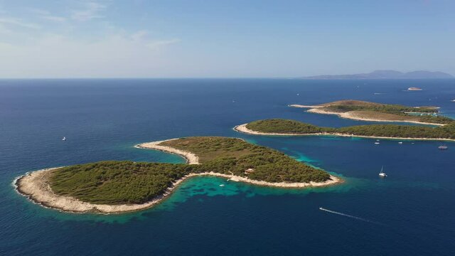 Aerial footage of the Jerolim and Paklinski islands near the famous Hvar island in the Adriatic sea in Croatia. Shot with a rotation motion