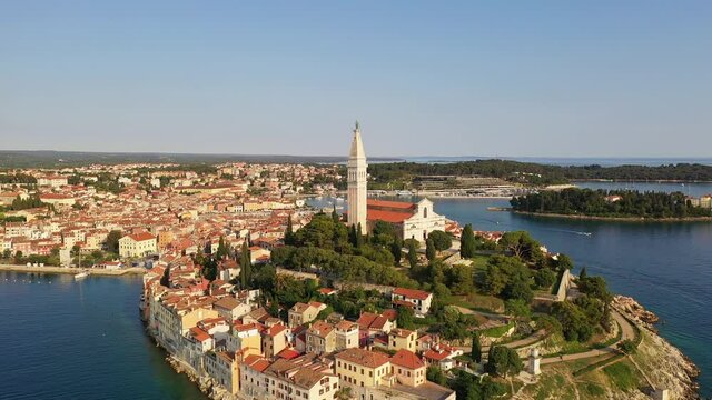 Aerial footage of the famous Rovinj old town in Istria by the Adriatic sea in Croatia. Shot with a backward motion