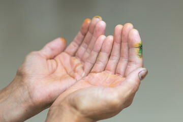 Isolated male hands praying on white background