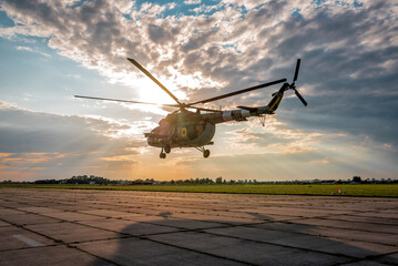 Fototapeta na wymiar military helicopter takes off into the air