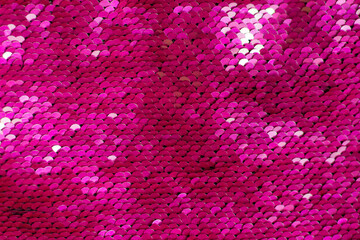 Pink glittering texture background from sequins.