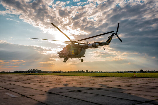 military helicopter takes off into the air