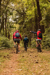 Obraz premium Bikers in the jungle. Bikers exercise outdoors. Concept of sport and outdoors.