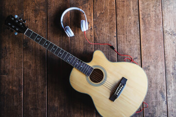 Fototapeta premium Classical guitar and music headphones