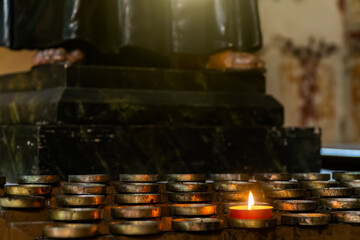 Blurred architecture background of church interior inside old cathedral catholic holy pray god jesus religion with candles 