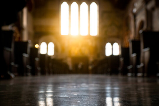 Blurred architecture background of church interior inside old cathedral catholic holy pray god jesus religion with candles 