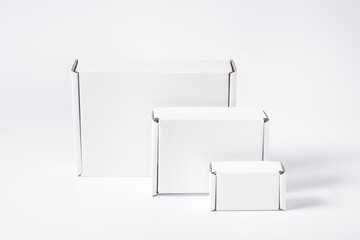 Set of different white cardboard, carton flat boxes on background