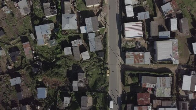 Aerial: Ordinary day in African township above Knysna, South Africa