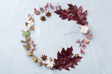 Creative autumn fall thanksgiving day composition with decorative leaves