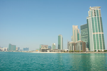 Fototapeta na wymiar Abu Dhabi skyline seen from the Corniche on the Persian Gulf in United Arab Emirates