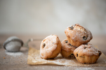 small homemade muffins with cinnamon, chocolate and raisins