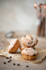 small homemade muffins with cinnamon, chocolate and raisins