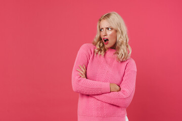Image of displeased blonde girl posing with arms crossed