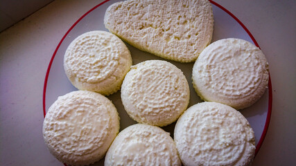 Delicate Circles Of Delicious Cow Cheese Curd Ready To Be Consumed.
