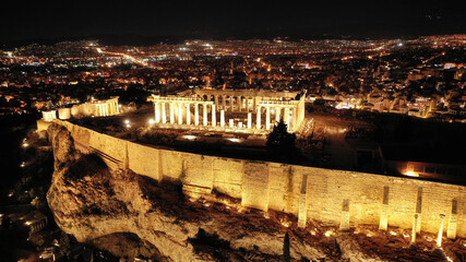 Fototapeta na wymiar Aerial drone night shot of illuminated iconic Acropolis hill and the Parthenon, Athens, Attica, Greece